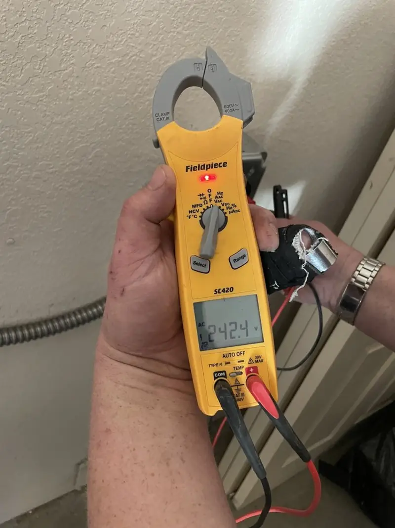 Voltage testing with clamp meter during Electrical Installation Services in Egg Harbor City